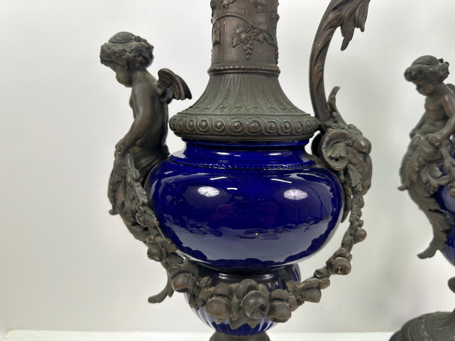 Pair Of French Decorative Ewers With Dolphin Handles And Cherub Figure - Note That A Piece Of The Metal Is Missing On One Ewer On Wooden Base 25.5'H [Photo 17]