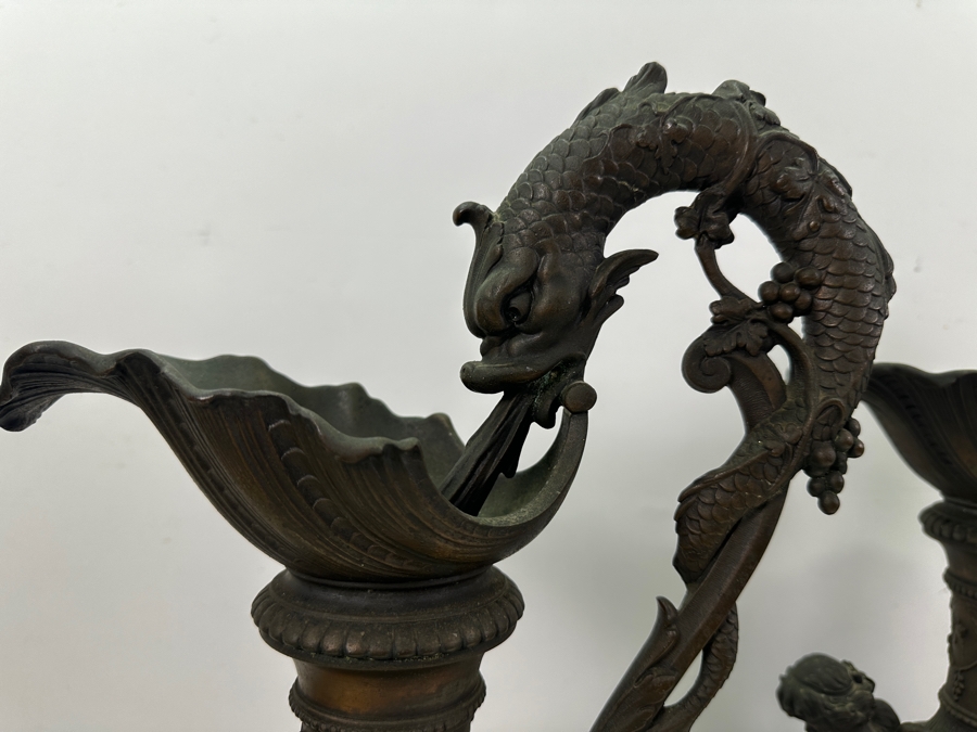Pair Of French Decorative Ewers With Dolphin Handles And Cherub Figure - Note That A Piece Of The Metal Is Missing On One Ewer On Wooden Base 25.5'H [Photo 18]