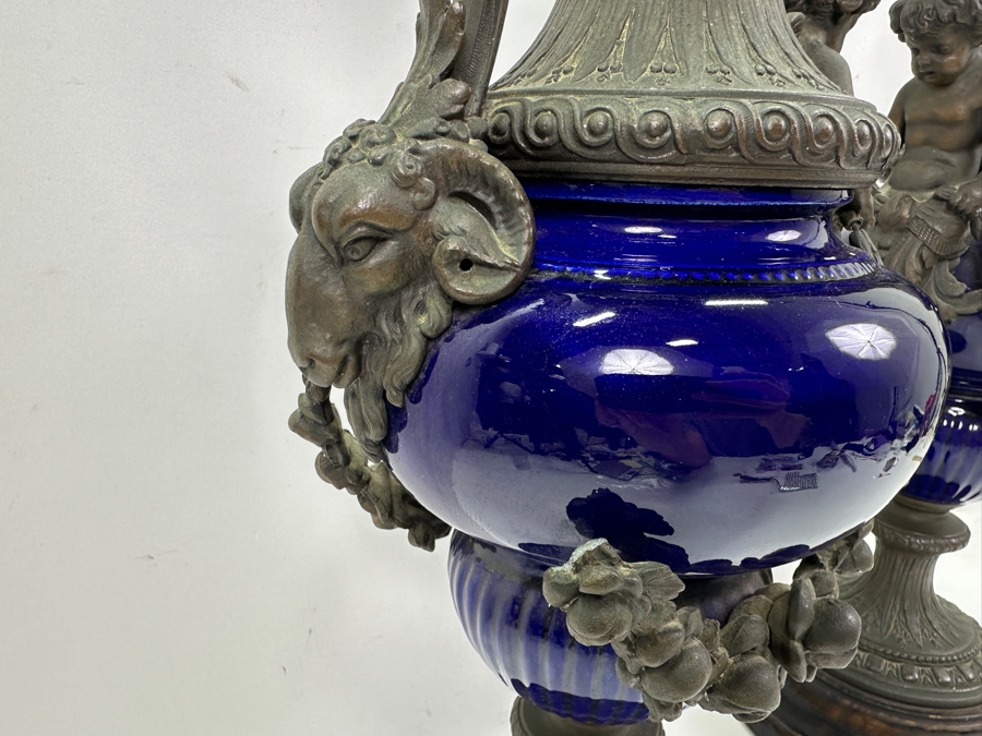 Pair Of French Decorative Ewers With Dolphin Handles And Cherub Figure - Note That A Piece Of The Metal Is Missing On One Ewer On Wooden Base 25.5'H [Photo 15]