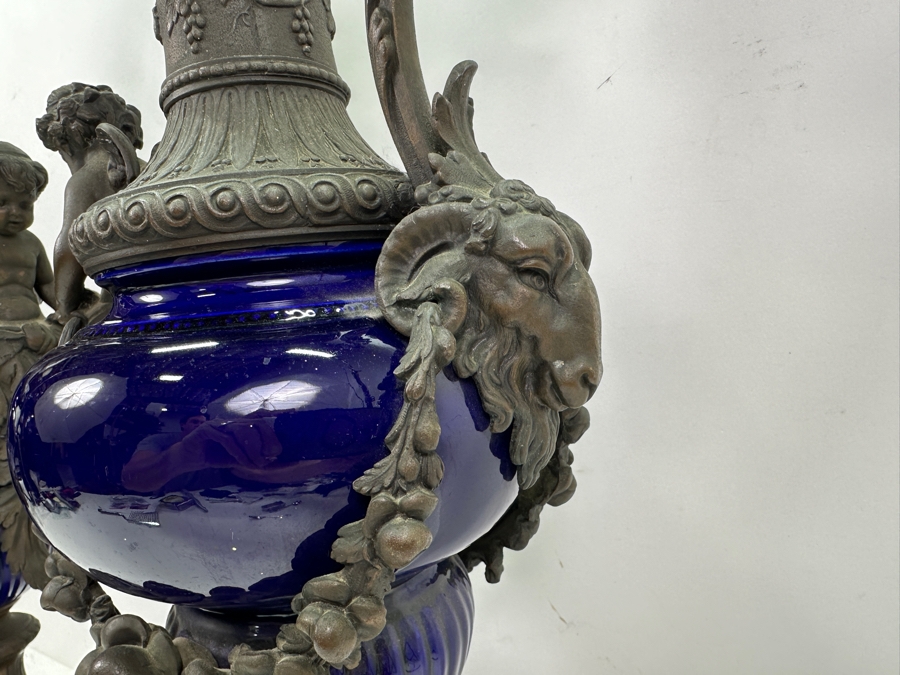 Pair Of French Decorative Ewers With Dolphin Handles And Cherub Figure - Note That A Piece Of The Metal Is Missing On One Ewer On Wooden Base 25.5'H [Photo 11]