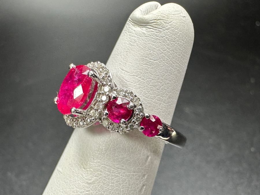 14k Gold Ring Set With Glass Filled Rubies (1) 7 X 5mm Oval Ruby, (2) 3.5mm Round Rubies & (2) 3.0mm Round Rubies Accented With (40) .5mm Round Brilliant Diamonds Est. .18cttw H-I, SI1-2 Size 4 3.9g Retails $1,300 [Photo 5]