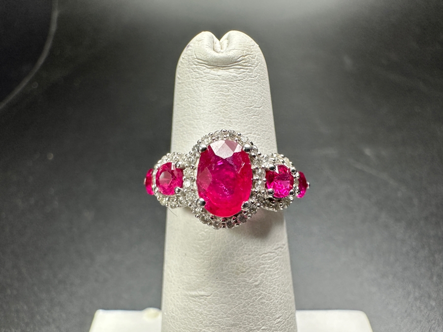 14k Gold Ring Set With Glass Filled Rubies (1) 7 X 5mm Oval Ruby, (2) 3.5mm Round Rubies & (2) 3.0mm Round Rubies Accented With (40) .5mm Round Brilliant Diamonds Est. .18cttw H-I, SI1-2 Size 4 3.9g Retails $1,300 [Photo 2]