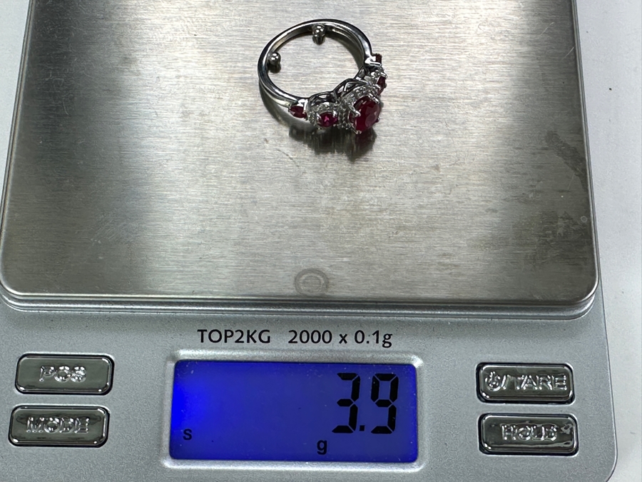 14k Gold Ring Set With Glass Filled Rubies (1) 7 X 5mm Oval Ruby, (2) 3.5mm Round Rubies & (2) 3.0mm Round Rubies Accented With (40) .5mm Round Brilliant Diamonds Est. .18cttw H-I, SI1-2 Size 4 3.9g Retails $1,300 [Photo 10]