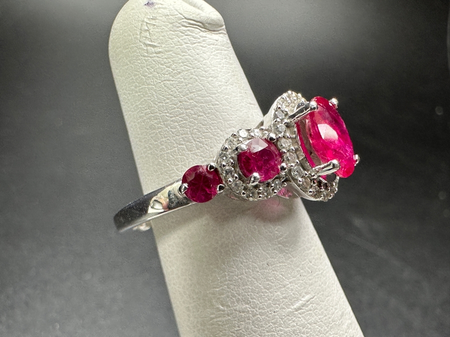 14k Gold Ring Set With Glass Filled Rubies (1) 7 X 5mm Oval Ruby, (2) 3.5mm Round Rubies & (2) 3.0mm Round Rubies Accented With (40) .5mm Round Brilliant Diamonds Est. .18cttw H-I, SI1-2 Size 4 3.9g Retails $1,300 [Photo 4]