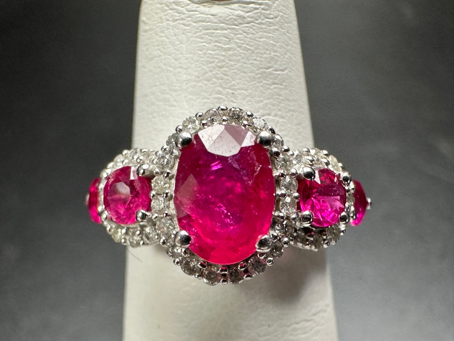 14k Gold Ring Set With Glass Filled Rubies (1) 7 X 5mm Oval Ruby, (2) 3.5mm Round Rubies & (2) 3.0mm Round Rubies Accented With (40) .5mm Round Brilliant Diamonds Est. .18cttw H-I, SI1-2 Size 4 3.9g Retails $1,300 [Photo 3]