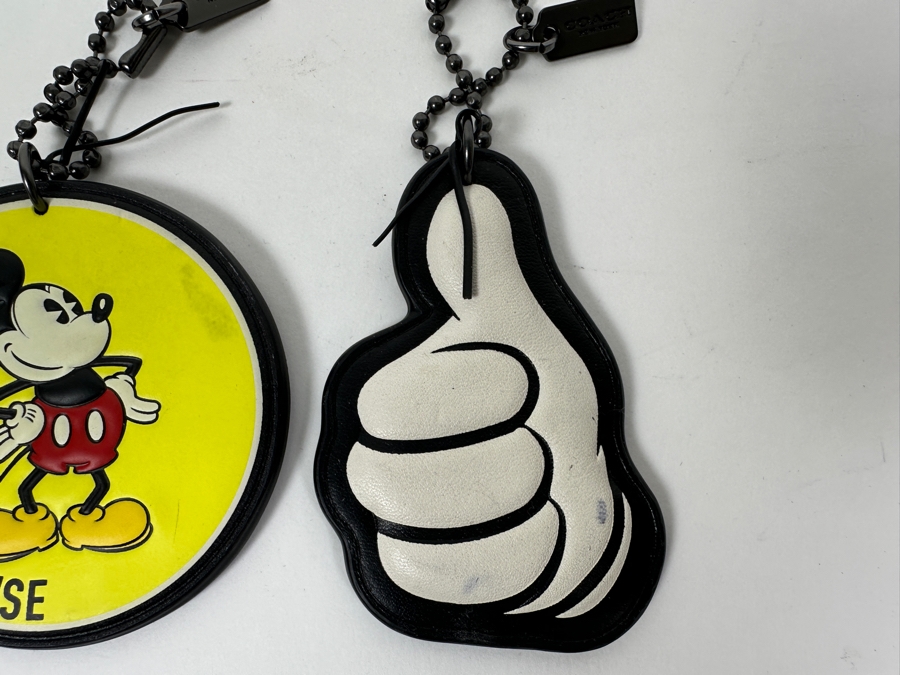 Pair Of Disney x Coach Mickey Mouse Leather Hangtag Bag Charm And Mickey Mouse Thumbs Up Tag Charm By Coach Handbags [Photo 5]