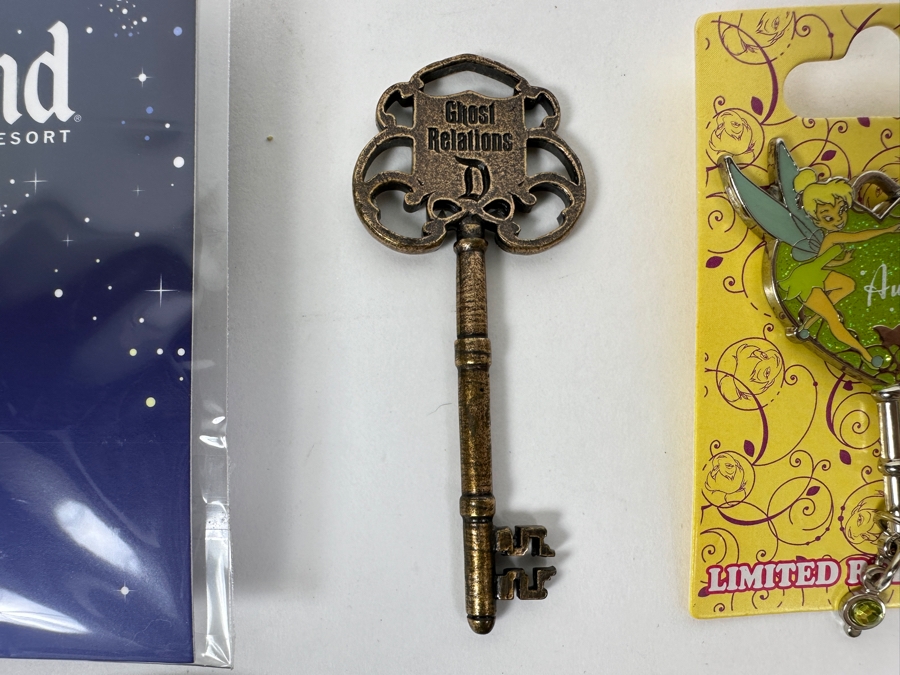 Collection Of Disneyland Collectibles Including Magic Key Trading Pin, Limited Edition Tinker Bell Trading Pin, Button, Disneyland Haunted Mansion Key And Star Wars May The 4th Be With You Key [Photo 3]