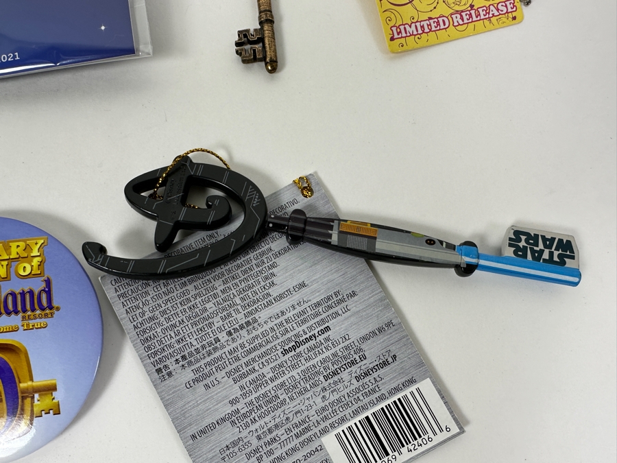 Collection Of Disneyland Collectibles Including Magic Key Trading Pin, Limited Edition Tinker Bell Trading Pin, Button, Disneyland Haunted Mansion Key And Star Wars May The 4th Be With You Key [Photo 10]