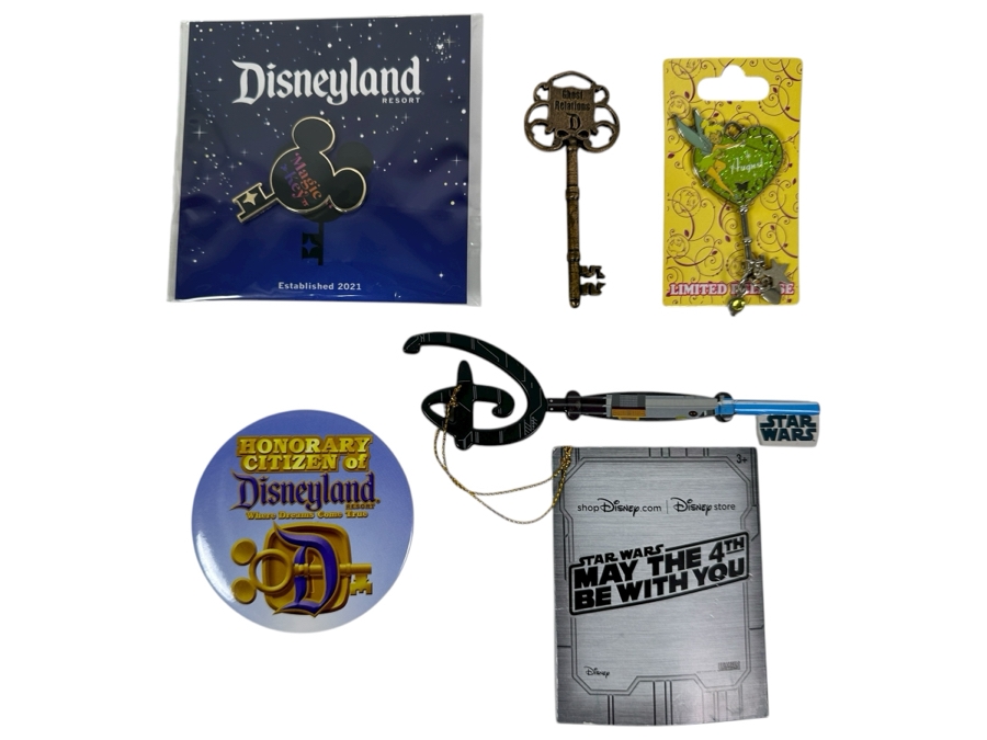 Collection Of Disneyland Collectibles Including Magic Key Trading Pin, Limited Edition Tinker Bell Trading Pin, Button, Disneyland Haunted Mansion Key And Star Wars May The 4th Be With You Key