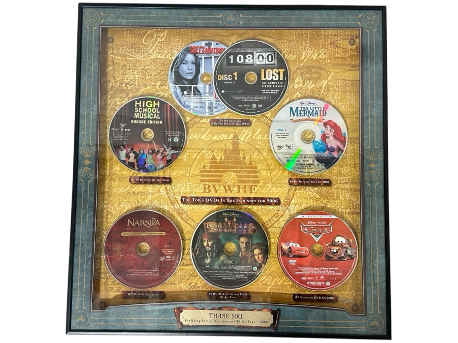 Buena Vista Home Entertainment Limited Edition Commemorative Numbered 123/500 With Dvds Of Disney Pixar Cars, Walt Disney's Pirates Of The Caribbean, The Chronicles Of Narnia, The Little Mermaid, High School Musical, Lost & Grey's Anatomy 18.5 X 19.5