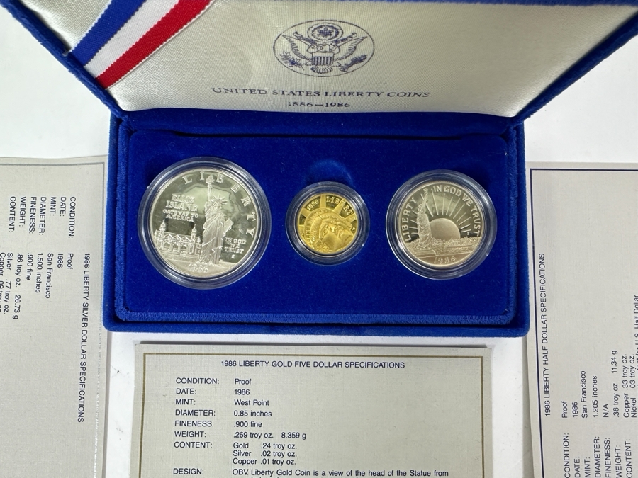 1986 Mint United States Liberty Coins: (1) 1986 Liberty Gold Five Dollar Coin (.900 Fine Gold / .269 Troy Oz), (1) 1986 Liberty Silver Dollar Coin (.900 Fine Silver / .86 Troy Oz) & (1) 1986 Liberty Half Dollar Coin