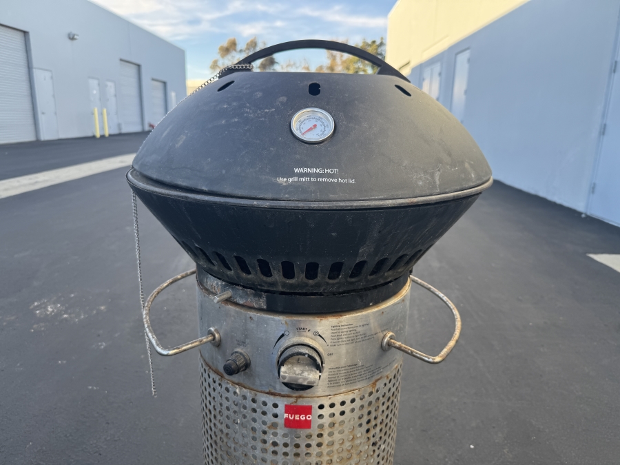 Fuego Professional Gas Grill With A Black Lid, Stainless Steel Body, And Wheels [Photo 3]