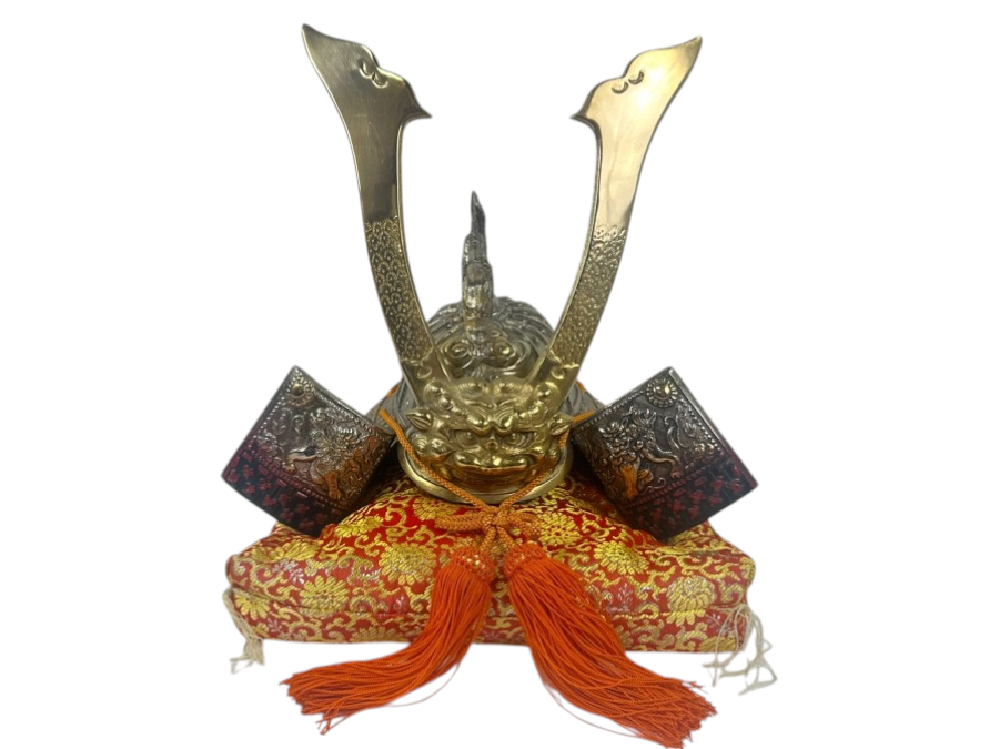 Reproduction Ornate Golden Samurai Helmet On Red Brocade Pillow With Tassels 12.5'W x 12'H