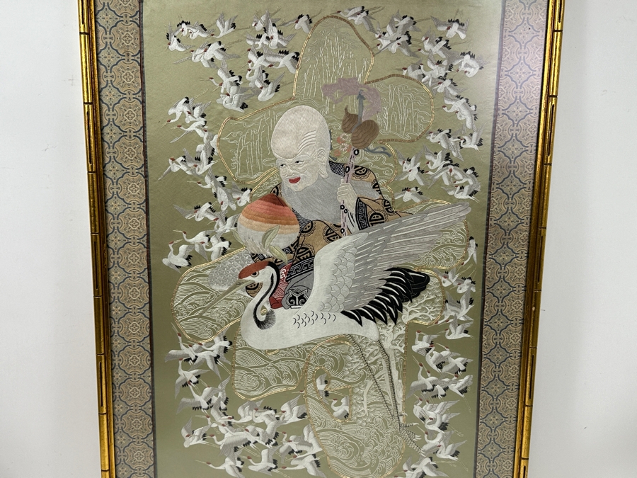 Framed Embroidered Silk Panel Depicting Taoist Immortal ShouXing Surrounded by Cranes 23.5'W x 32'H [Photo 10]
