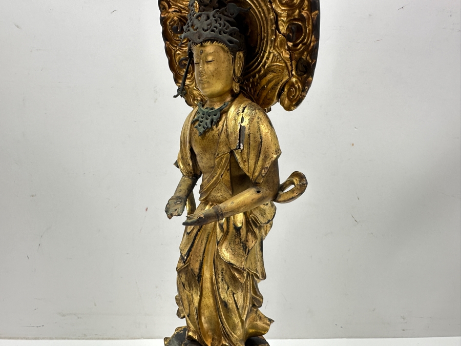 Antique Japanese Edo Period (1603-1868) Carved Gilt Wooden Sculpture Of Guanyin Buddha Standing On A Lotus Base With Halo Mandorla Behind The Figure (Some Damage To Multiple Areas Including Hands) 15.5'H Estimate $2,000-$4,000 [Photo 14]