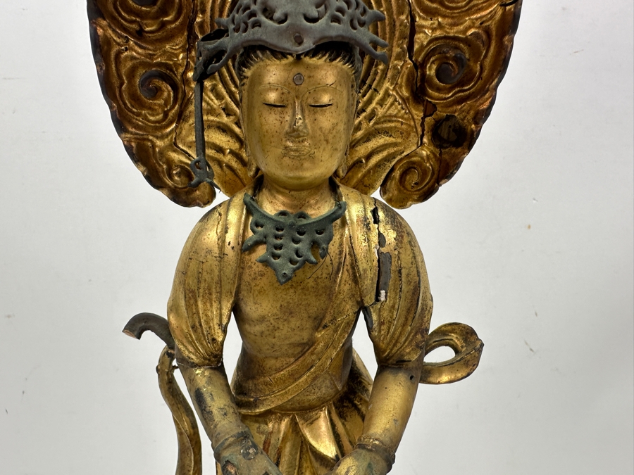 Antique Japanese Edo Period (1603-1868) Carved Gilt Wooden Sculpture Of Guanyin Buddha Standing On A Lotus Base With Halo Mandorla Behind The Figure (Some Damage To Multiple Areas Including Hands) 15.5'H Estimate $2,000-$4,000 [Photo 6]