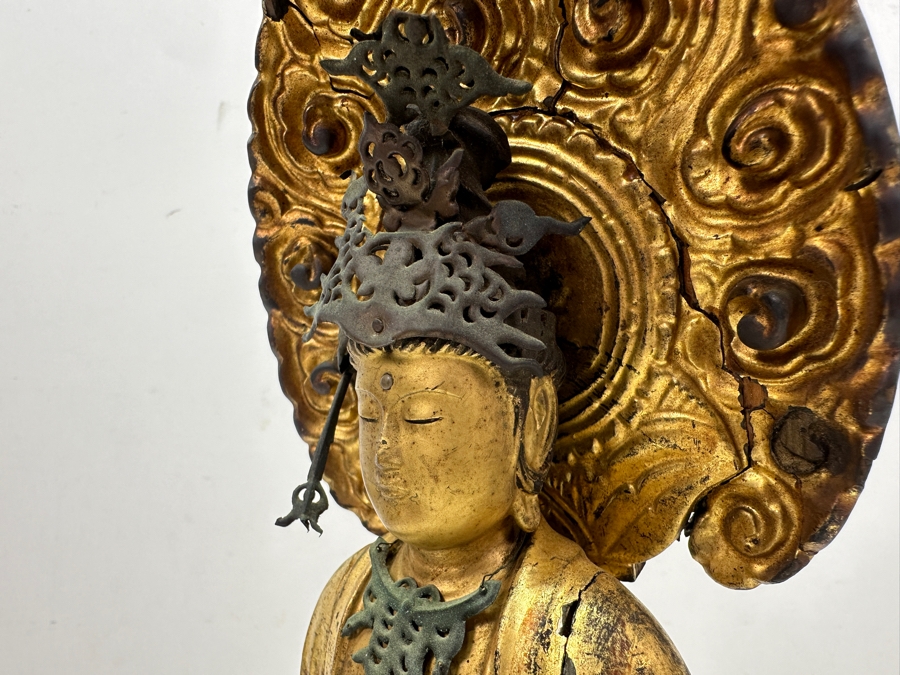 Antique Japanese Edo Period (1603-1868) Carved Gilt Wooden Sculpture Of Guanyin Buddha Standing On A Lotus Base With Halo Mandorla Behind The Figure (Some Damage To Multiple Areas Including Hands) 15.5'H Estimate $2,000-$4,000 [Photo 13]