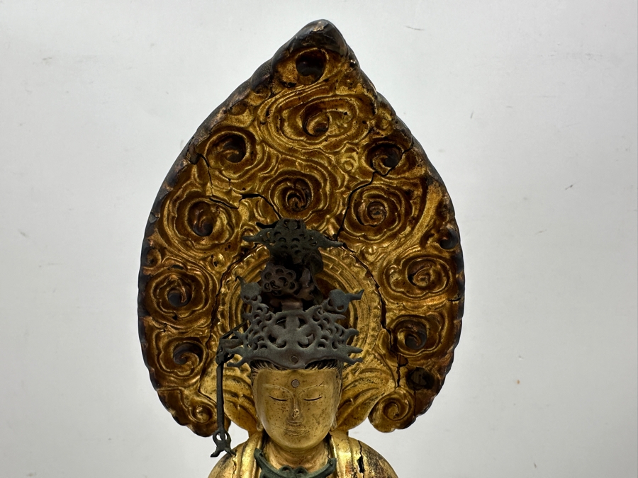 Antique Japanese Edo Period (1603-1868) Carved Gilt Wooden Sculpture Of Guanyin Buddha Standing On A Lotus Base With Halo Mandorla Behind The Figure (Some Damage To Multiple Areas Including Hands) 15.5'H Estimate $2,000-$4,000 [Photo 7]