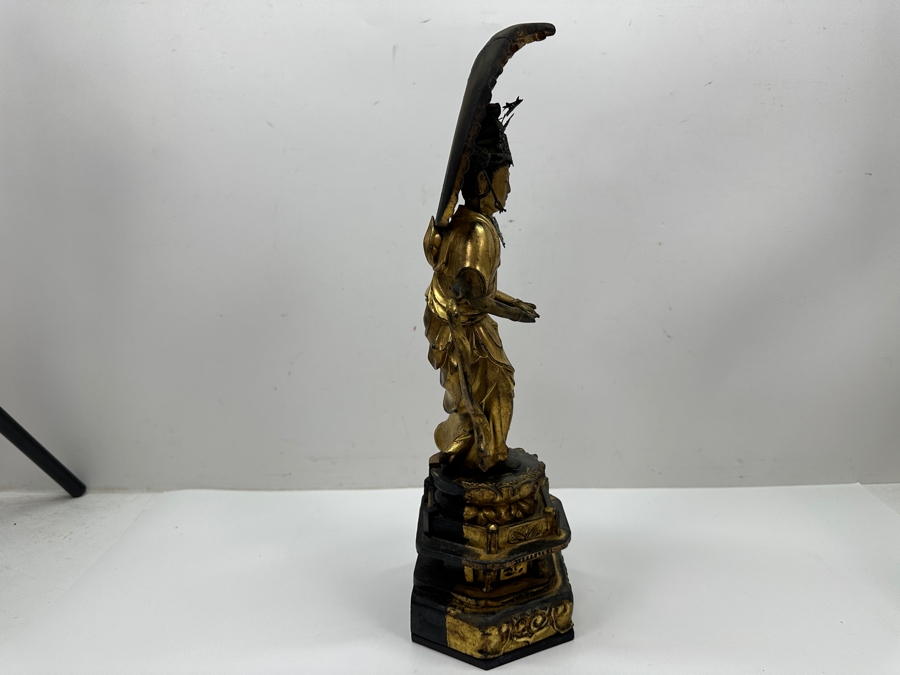 Antique Japanese Edo Period (1603-1868) Carved Gilt Wooden Sculpture Of Guanyin Buddha Standing On A Lotus Base With Halo Mandorla Behind The Figure (Some Damage To Multiple Areas Including Hands) 15.5'H Estimate $2,000-$4,000 [Photo 9]