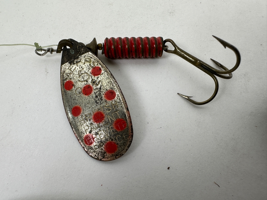 Collection Of Vintage Fishing Lures Including A Hellbender 'Hellraiser' Topwater Lure In Original Box, Johnson Silver Minnow Spoon, And Various Other Spinners And Spoons From The Mid-20th Century. 
 [Photo 2]