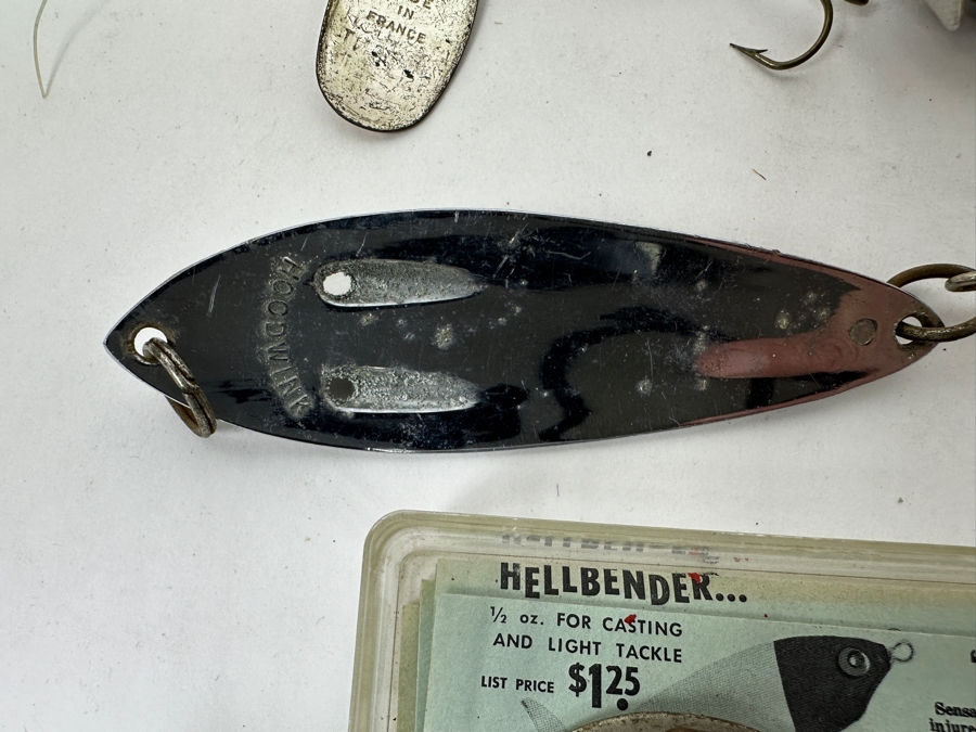 Collection Of Vintage Fishing Lures Including A Hellbender 'Hellraiser' Topwater Lure In Original Box, Johnson Silver Minnow Spoon, And Various Other Spinners And Spoons From The Mid-20th Century. 
 [Photo 16]
