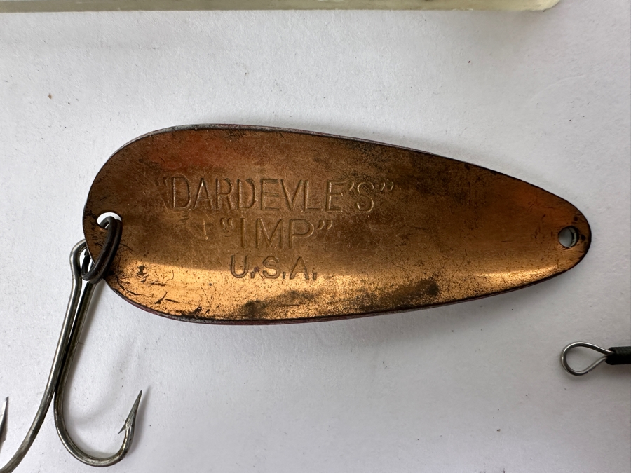 Collection Of Vintage Fishing Lures Including A Hellbender 'Hellraiser' Topwater Lure In Original Box, Johnson Silver Minnow Spoon, And Various Other Spinners And Spoons From The Mid-20th Century. 
 [Photo 9]