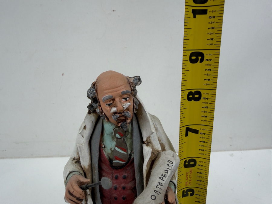 Hand Painted Pottery Sculpture Of An Orthopedic Doctor Figurine Holding Cast And Instrument Wearing Lab Coat And Striped Tie With Ortopedico Label 8.5'H [Photo 7]