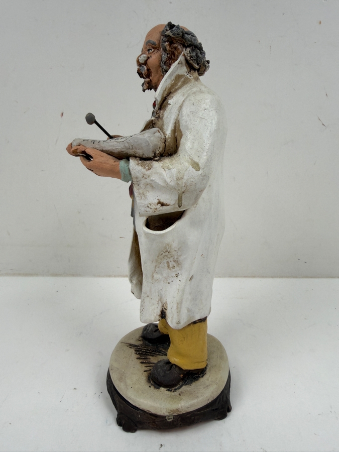 Hand Painted Pottery Sculpture Of An Orthopedic Doctor Figurine Holding Cast And Instrument Wearing Lab Coat And Striped Tie With Ortopedico Label 8.5'H [Photo 3]