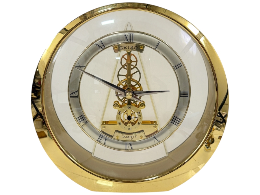 Seiko Quartz Gold Tone Round Skeleton Desk Mantel Clock With Exposed Gears And Roman Numerals Model QAW113G Made In Japan 8.5'W X 8.5'H