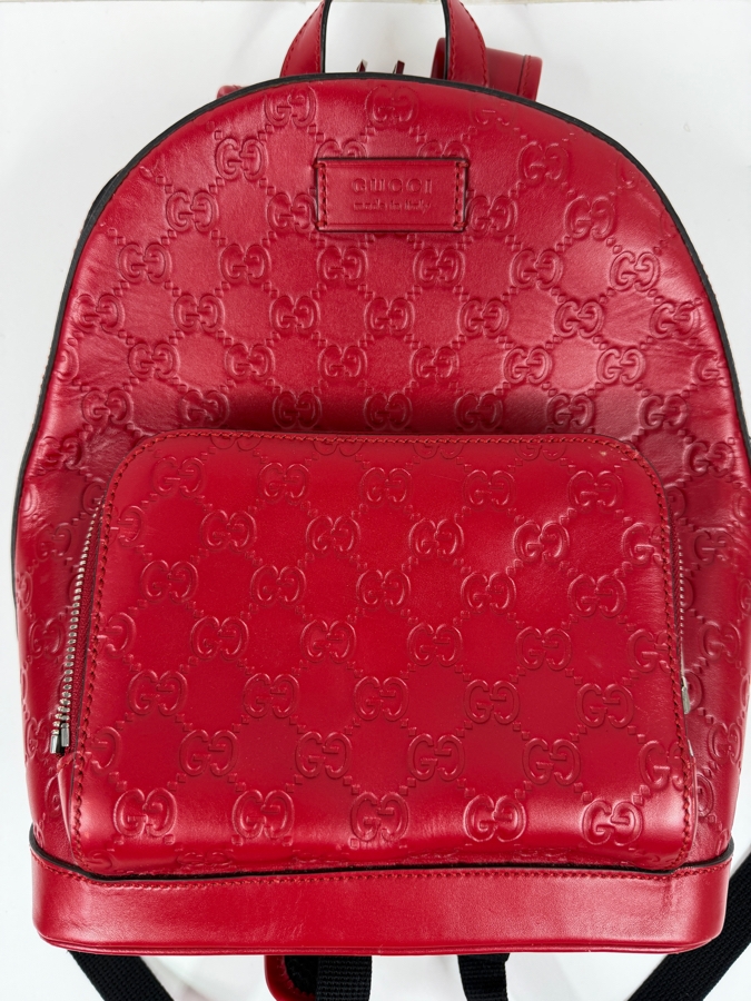 Authentic Gucci Red Signature Guccissima Leather GG Embossed Backpack Bag With Front Zip Pocket And Black Adjustable Straps Made In Italy 10.5'W x 11'H (HA) [Photo 2]
