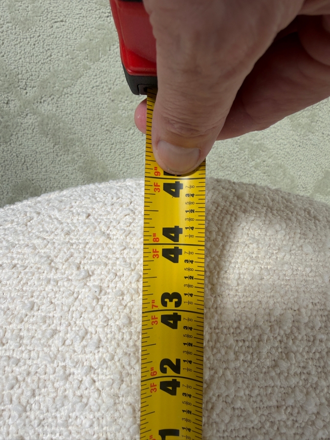 TOV Furniture Discus Oval Bouclé Upholstered Coffee Table Ottoman With Pillar Legs 45'W X 27'D X 17'H Retails $399 (HA) [Photo 7]