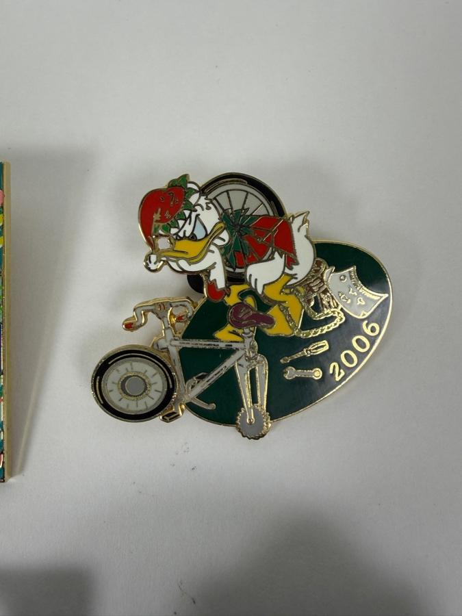 Disney Parks Collector Pin Set - Disneyland Annual Passholder Donald Duck 2012, Ariel & Flounder D23 Expo 2019, Donald Duck Hidden Mickey Bicycle 2006, Donald Firefighter 2003, WDW 50th Anniversary Castle, And Disney Auctions Mickey & Minnie American Flag [Photo 7]