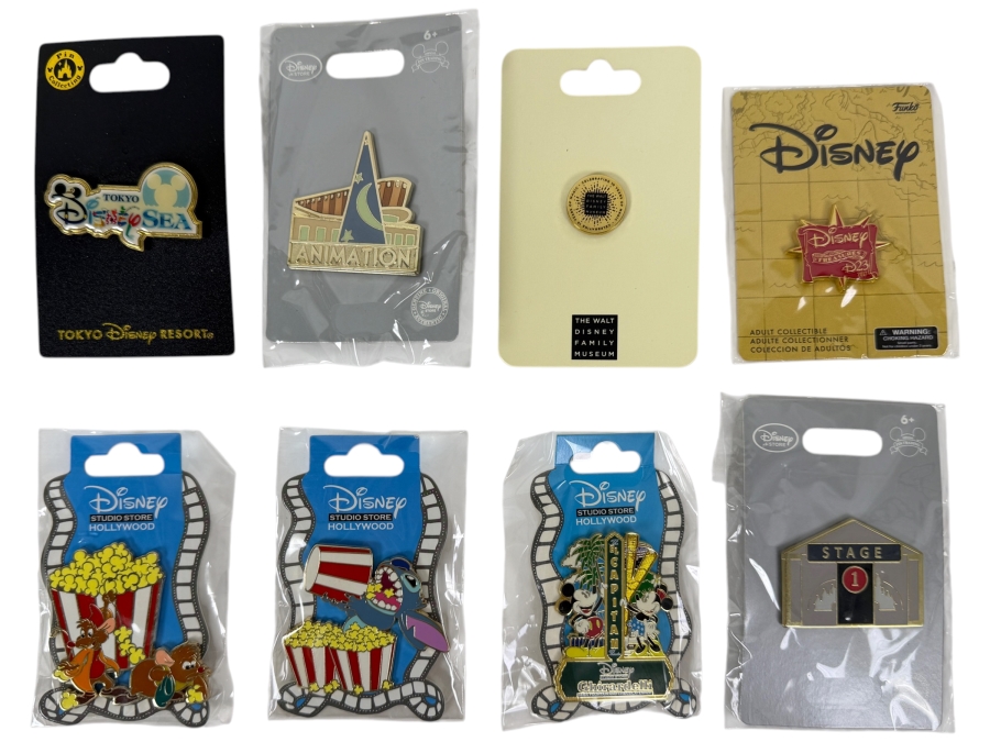 Assorted Collection Of Eight Authentic Disney Pins Including Tokyo DisneySea Logo, Disney Animation Building, And Disney Studio Store Hollywood Film Strip Series