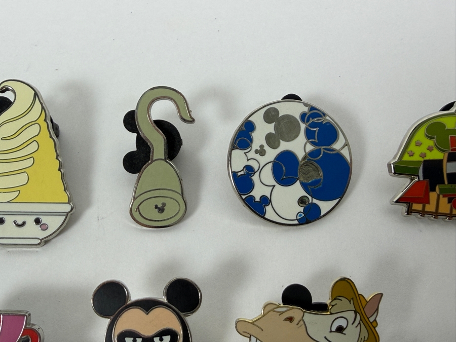 Collection Of (24) Authentic Disney Pins Featuring Characters Like Mickey Mouse As Mr. Incredible, Violet Parr, Timon and Pumbaa Wild About Safety Logo, And The Epcot World Showcase United Kingdom Flag Icon [Photo 12]