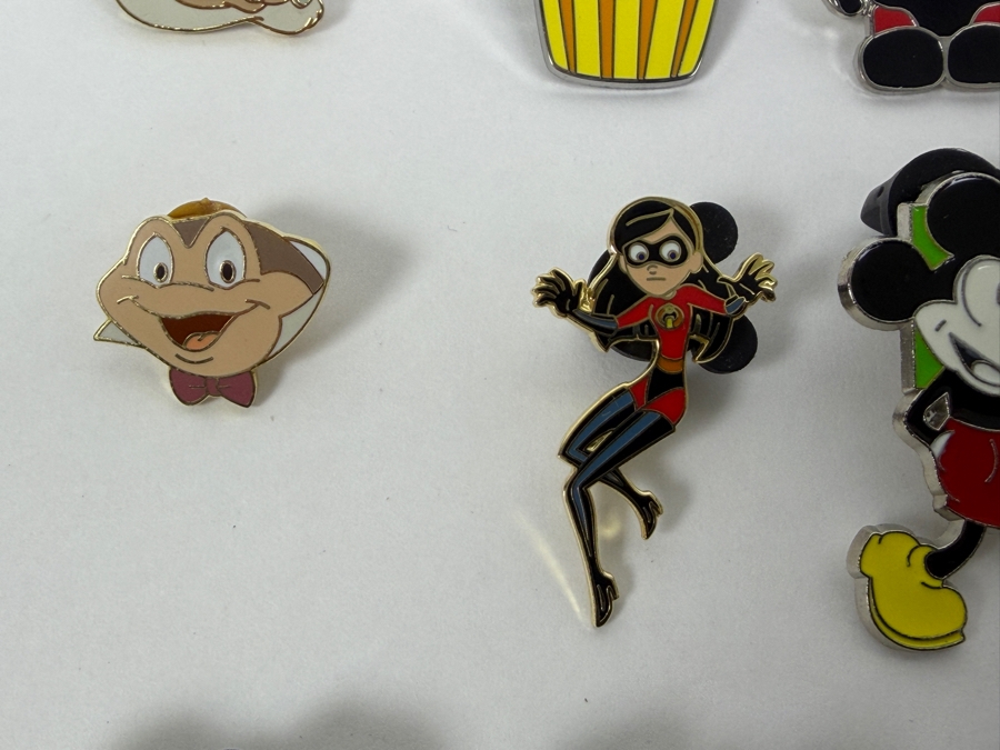 Collection Of (24) Authentic Disney Pins Featuring Characters Like Mickey Mouse As Mr. Incredible, Violet Parr, Timon and Pumbaa Wild About Safety Logo, And The Epcot World Showcase United Kingdom Flag Icon [Photo 7]