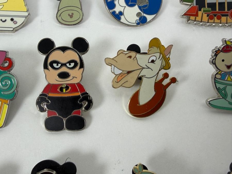 Collection Of (24) Authentic Disney Pins Featuring Characters Like Mickey Mouse As Mr. Incredible, Violet Parr, Timon and Pumbaa Wild About Safety Logo, And The Epcot World Showcase United Kingdom Flag Icon [Photo 9]