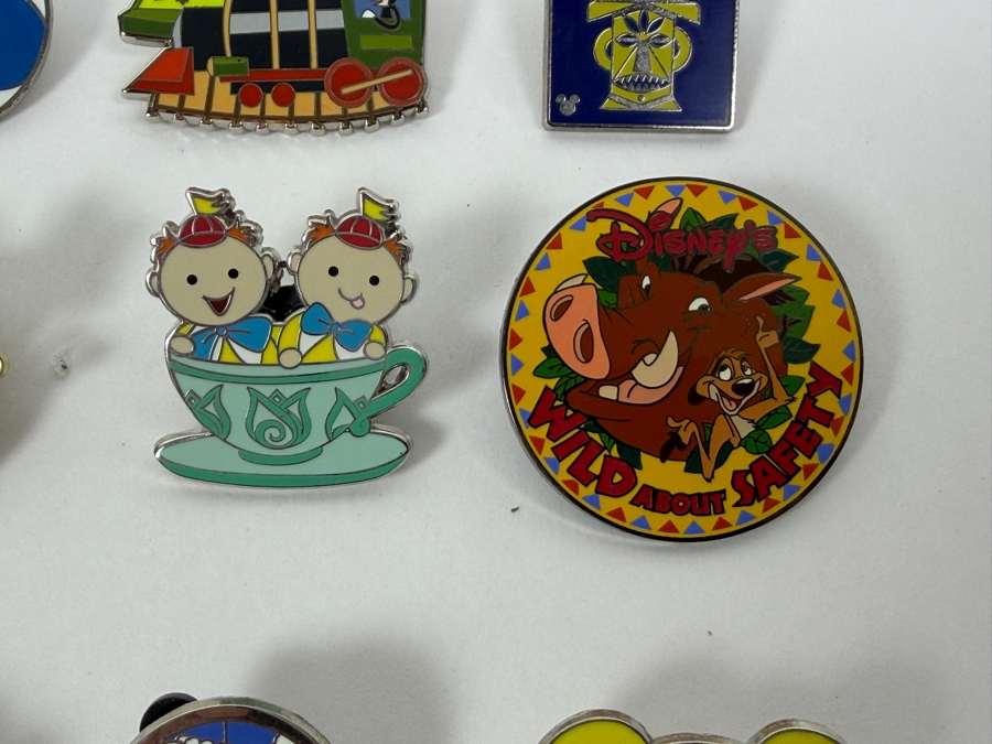 Collection Of (24) Authentic Disney Pins Featuring Characters Like Mickey Mouse As Mr. Incredible, Violet Parr, Timon and Pumbaa Wild About Safety Logo, And The Epcot World Showcase United Kingdom Flag Icon [Photo 10]