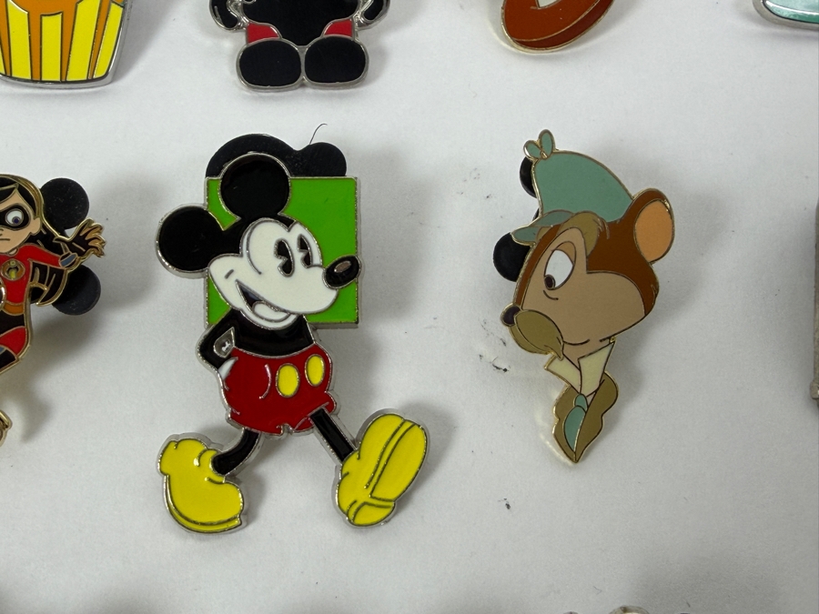 Collection Of (24) Authentic Disney Pins Featuring Characters Like Mickey Mouse As Mr. Incredible, Violet Parr, Timon and Pumbaa Wild About Safety Logo, And The Epcot World Showcase United Kingdom Flag Icon [Photo 6]