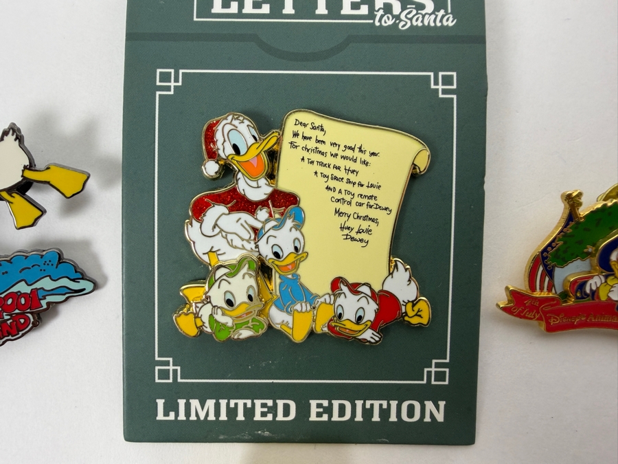 Just Added - Disney Limited Edition Pins: 2021 Letters To Santa Donald & Nephews LE 4000, 2001 Disneyland Summer Jet Ski Donald LE 3600, 2000 Animal Kingdom 4th Of July Donald, And 2002 All-American Picnic Donald LE 2500 Collection
 [Photo 2]