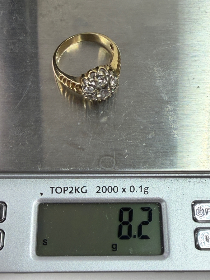 14k Gold Diamond Ring With 4.5mm Round Brilliant Cut Center Diamond Est. .40ct Surrounded By (6) 3mm Round Brilliant Cut Diamonds Est. .60cttw (Total Of 1.0cttw) Size 10.25 8.2g Retails $4,800 [Photo 12]