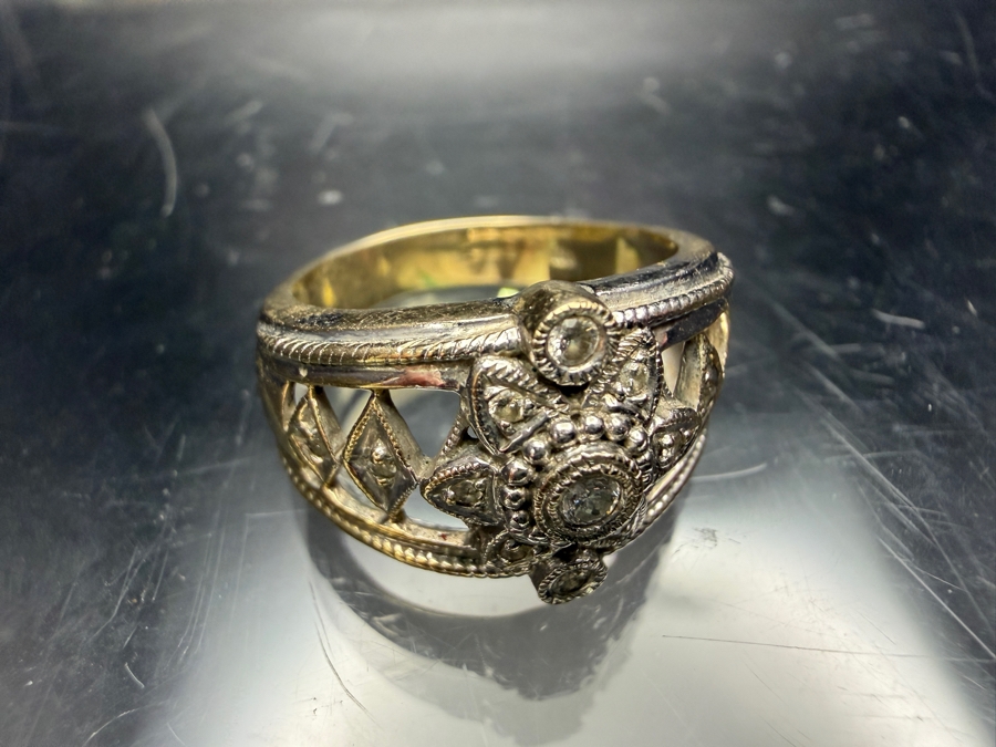 18k Gold Diamond Ring With (1) 1.8mm Round Brilliant (RB) Cut Diamond, (2) 1.5mm RB Diamonds And (10) .8mm RB Diamonds Est. .10cttw Size 7.75 7.0g Retails $3,600 [Photo 5]