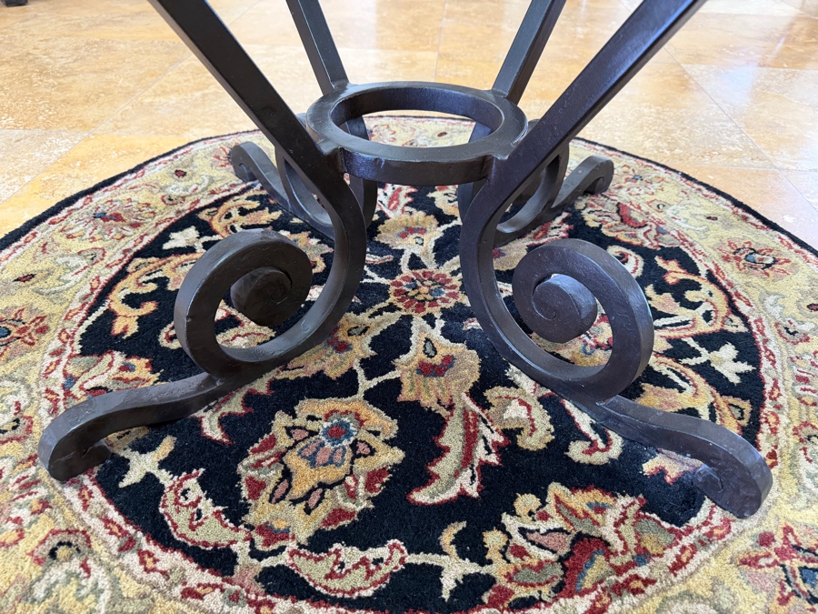 Round Glass Top Entry Table With Wrought Iron Scrollwork Pedestal Base (46'W X 31'H) On A Traditional Floral Medallion Circular Area Rug (43'W) [Photo 4]