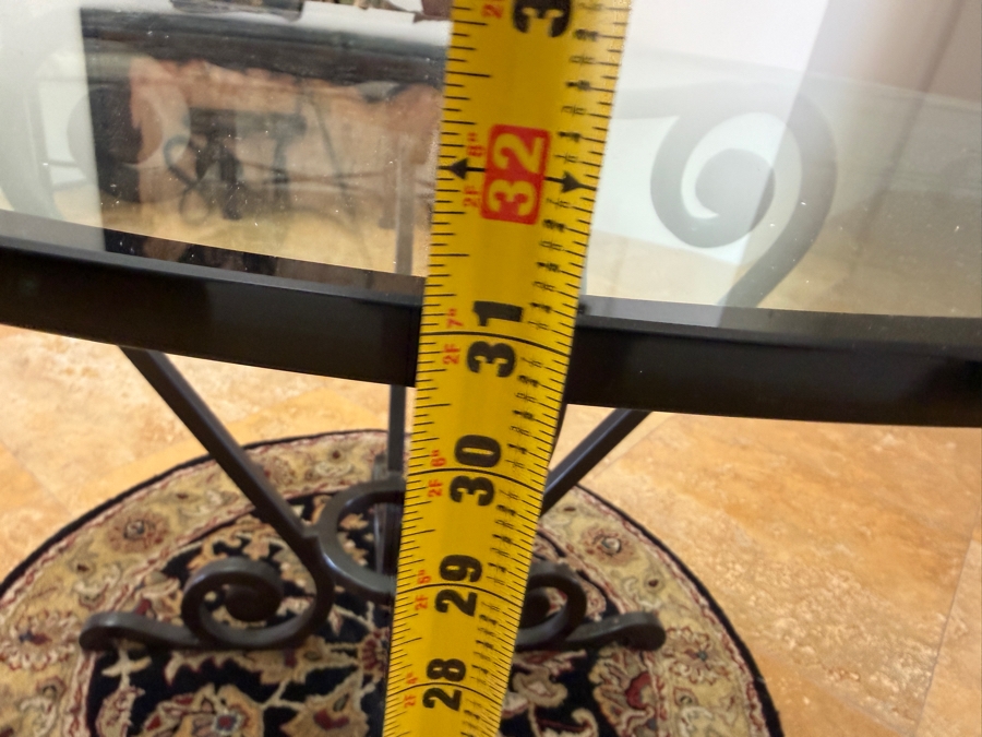 Round Glass Top Entry Table With Wrought Iron Scrollwork Pedestal Base (46'W X 31'H) On A Traditional Floral Medallion Circular Area Rug (43'W) [Photo 10]