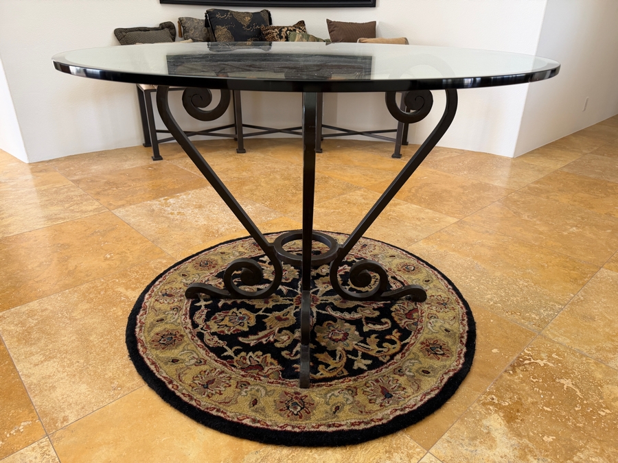 Round Glass Top Entry Table With Wrought Iron Scrollwork Pedestal Base (46'W X 31'H) On A Traditional Floral Medallion Circular Area Rug (43'W) [Photo 2]