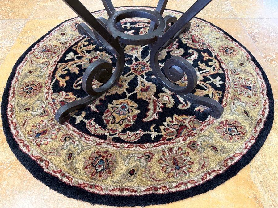 Round Glass Top Entry Table With Wrought Iron Scrollwork Pedestal Base (46'W X 31'H) On A Traditional Floral Medallion Circular Area Rug (43'W) [Photo 7]