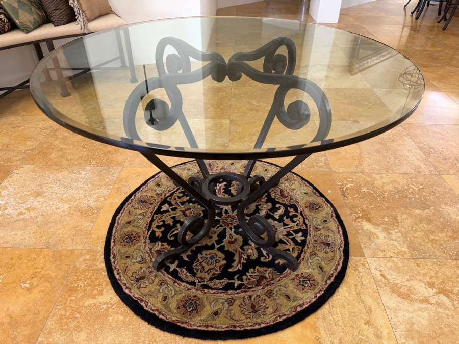 Round Glass Top Entry Table With Wrought Iron Scrollwork Pedestal Base (46'W X 31'H) On A Traditional Floral Medallion Circular Area Rug (43'W) [Photo 5]