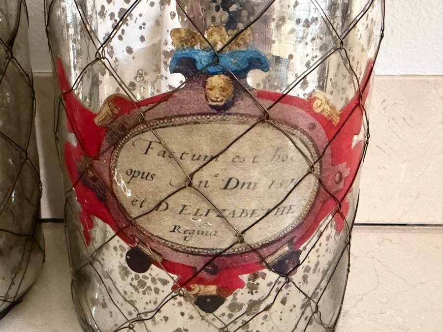 Decorative Vintage-Style Mercury Glass Apothecary Bottles Wrapped In Wire Netting With Traditional Illustration Decals 12'-13'H [Photo 3]