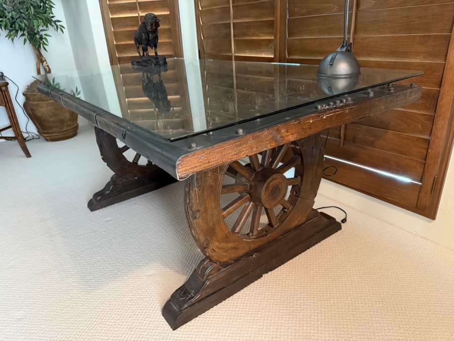 Custom Rustic Wagon Wheel Trestle Desk Featuring A Repurposed Antique Indian Door Top With Hand-Forged Iron Studs Strapping And Glass Top 72'W X 39'D X30'H [Photo 2]