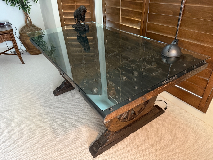 Custom Rustic Wagon Wheel Trestle Desk Featuring A Repurposed Antique Indian Door Top With Hand-Forged Iron Studs Strapping And Glass Top 72'W X 39'D X30'H [Photo 3]