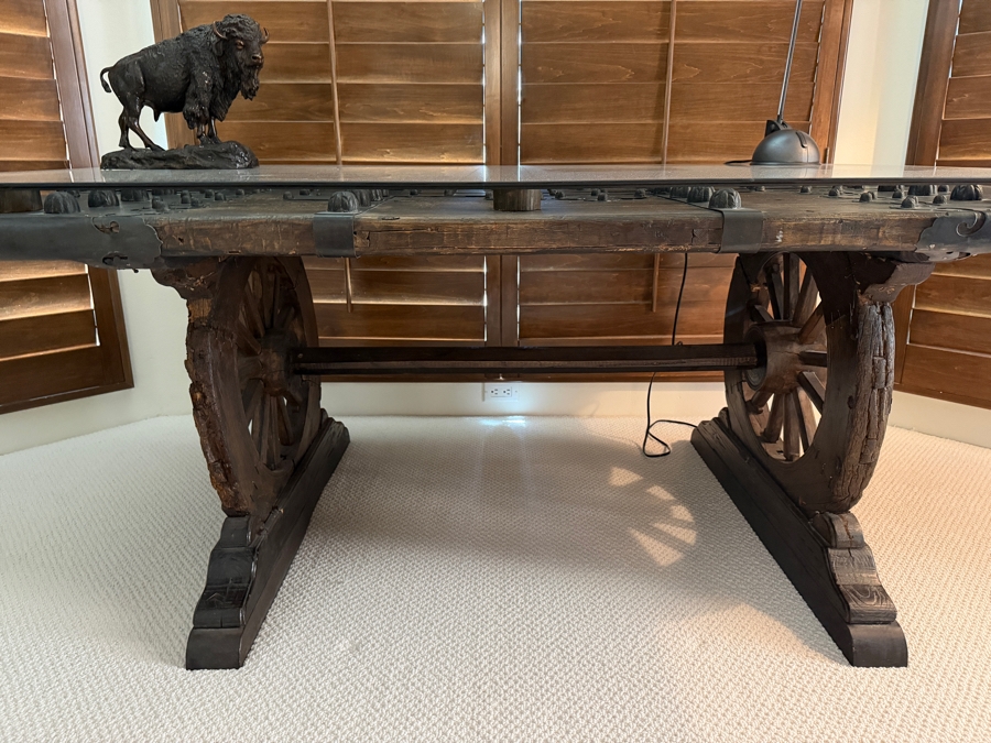 Custom Rustic Wagon Wheel Trestle Desk Featuring A Repurposed Antique Indian Door Top With Hand-Forged Iron Studs Strapping And Glass Top 72'W X 39'D X30'H [Photo 4]